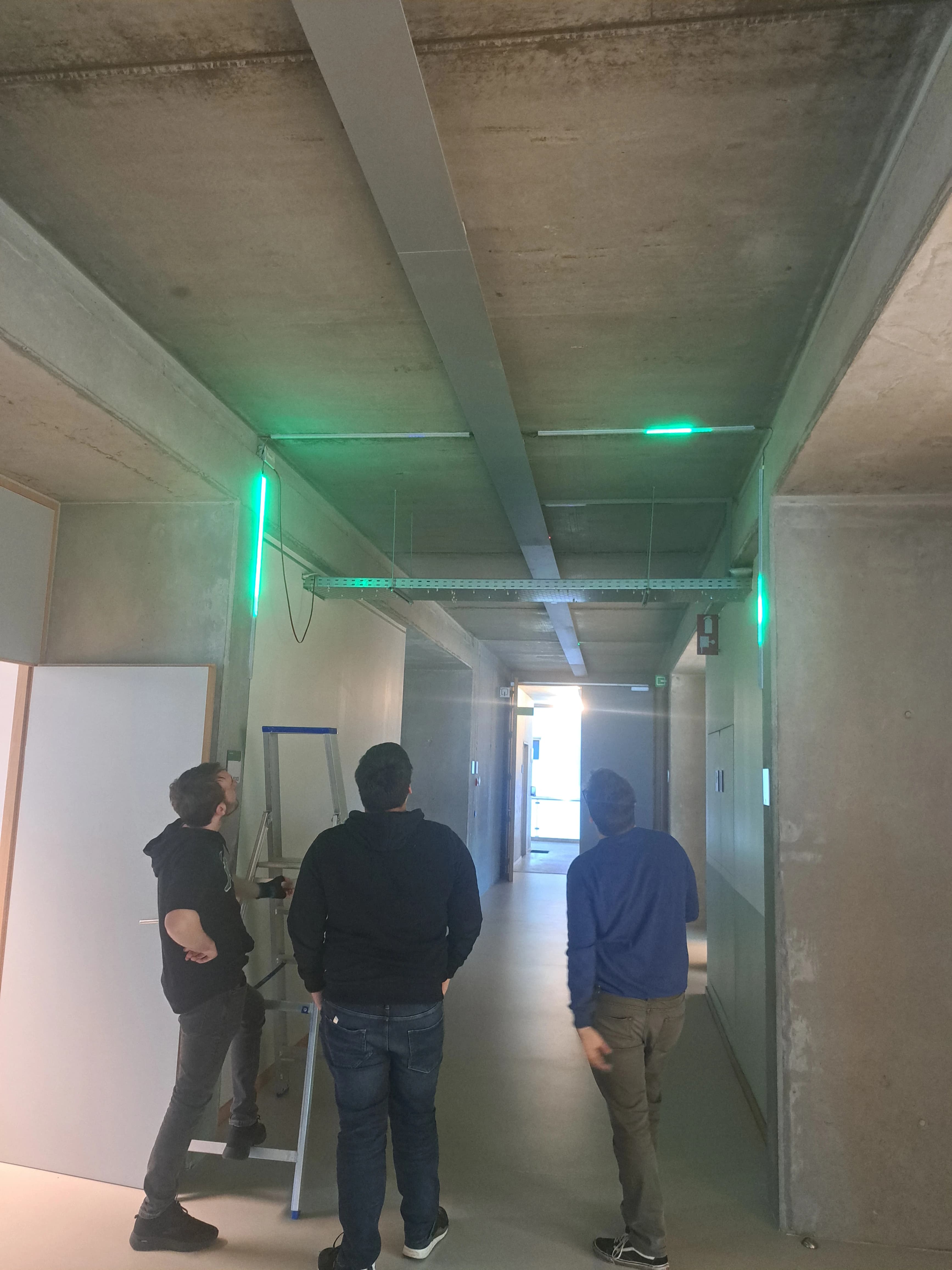 Team members programming and testing the interactive corridor systems